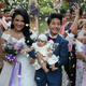 Bride Amornrat Ruamsin, 27, who is a transgender, holds up her five-month-old daughter with her groom Pitchaya Kachainrum, 16, during their wedding ceremony in Bangkok. The ceremony was not legally-binding, since Pitchaya is under 17, the legal age for marriage in Thailand. The couple plan to officially wed after her birthday.